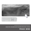 Oversized gaming mouse pad with graphic design on natural rubber base, showing keyboard and mouse placement.