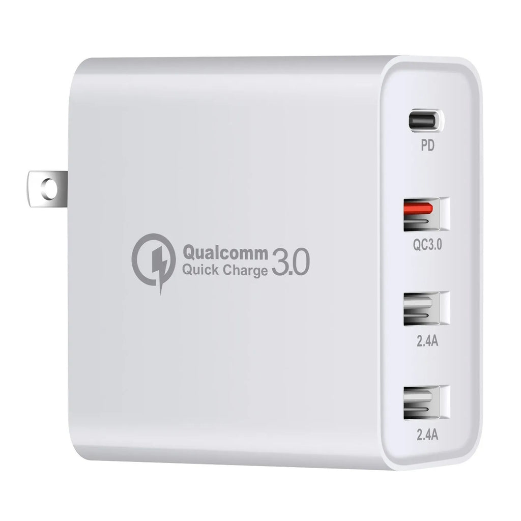 Black 48W USB-C four-port fast wall charger with UK plug on a wooden surface
