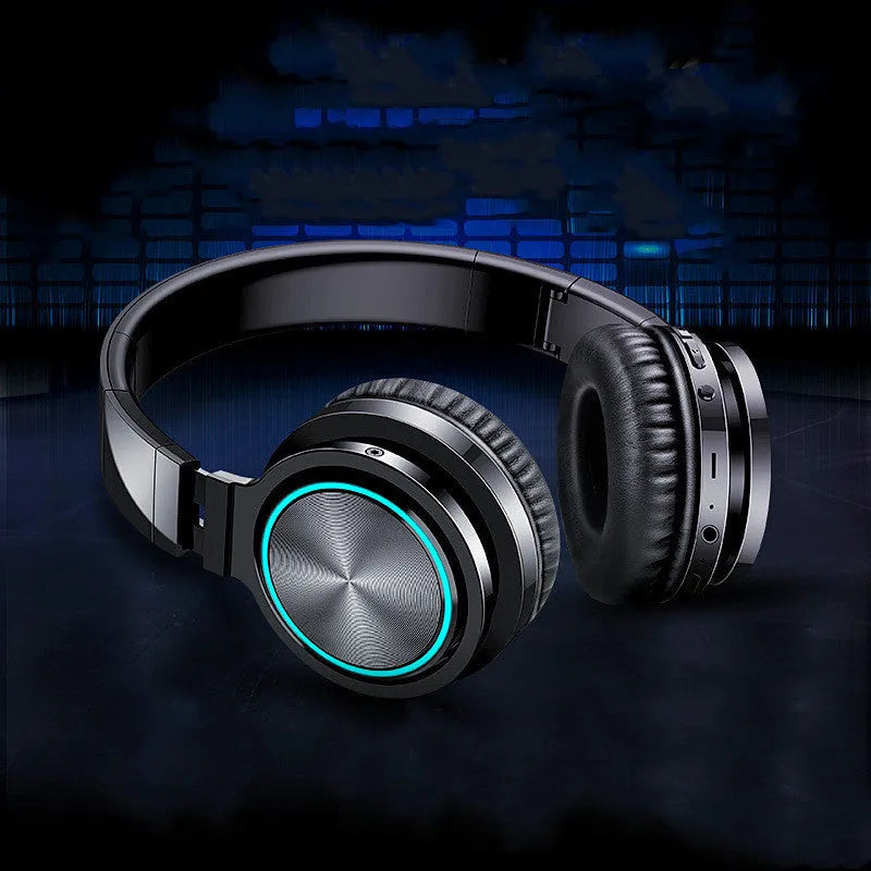 B12 wireless folding headset in black, red, and grey colour variants showing head-mounted design.