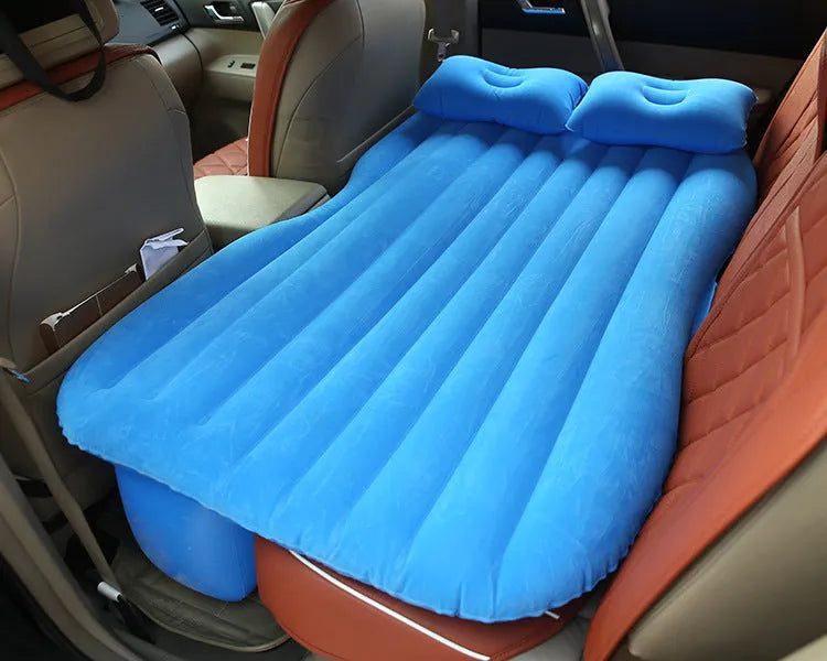 Black thickened flocking inflatable car bed set up in a vehicle with pillows.