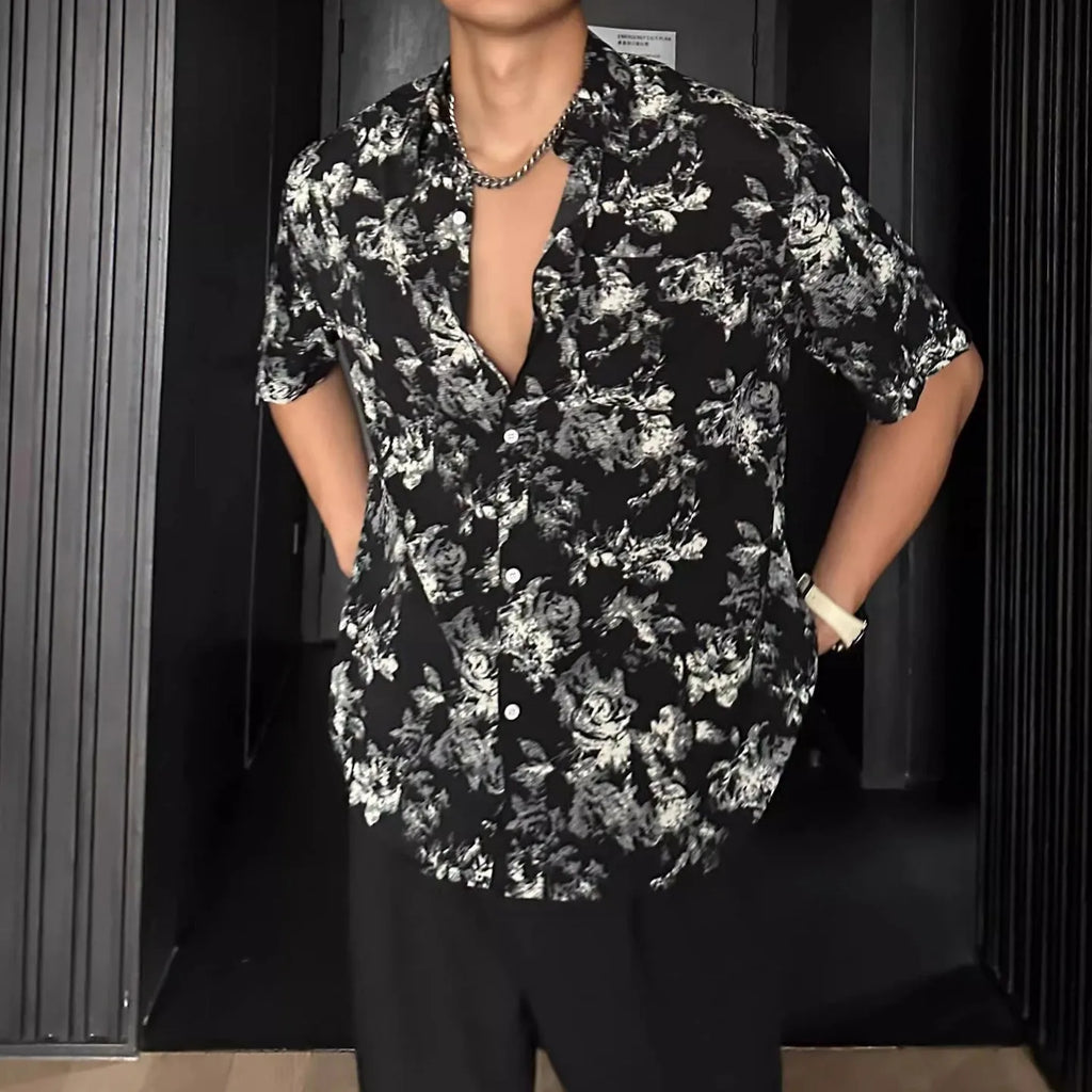 Loose fit short sleeve floral print shirt in white, shown on a hanger.