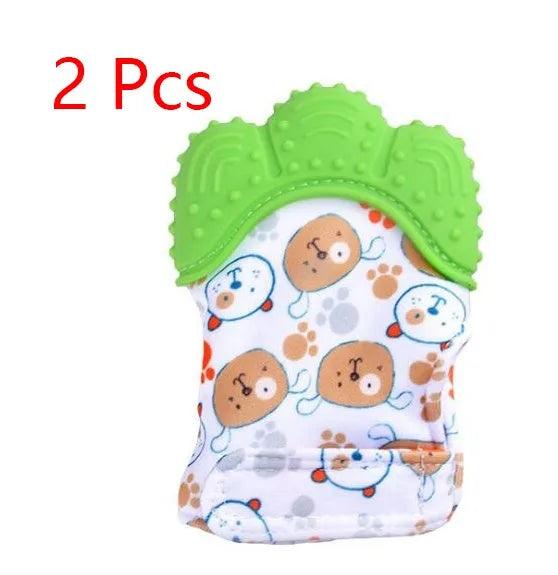 BPA-free silicone baby teether glove fastened with a white Velcro strap on a baby's hand