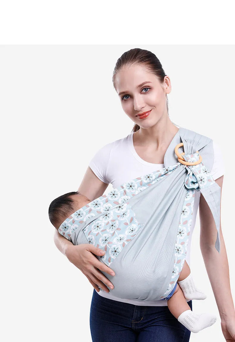 Adjustable baby wrap carrier sling shown in blue-green colour, suitable for newborns up to 36 months