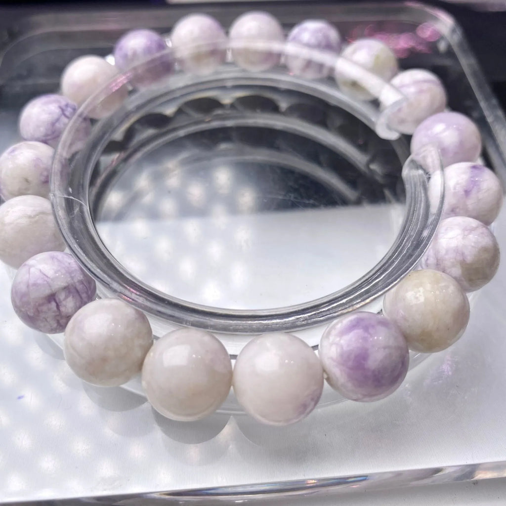 Women's natural purple turquoise bracelet showing different bead size options.