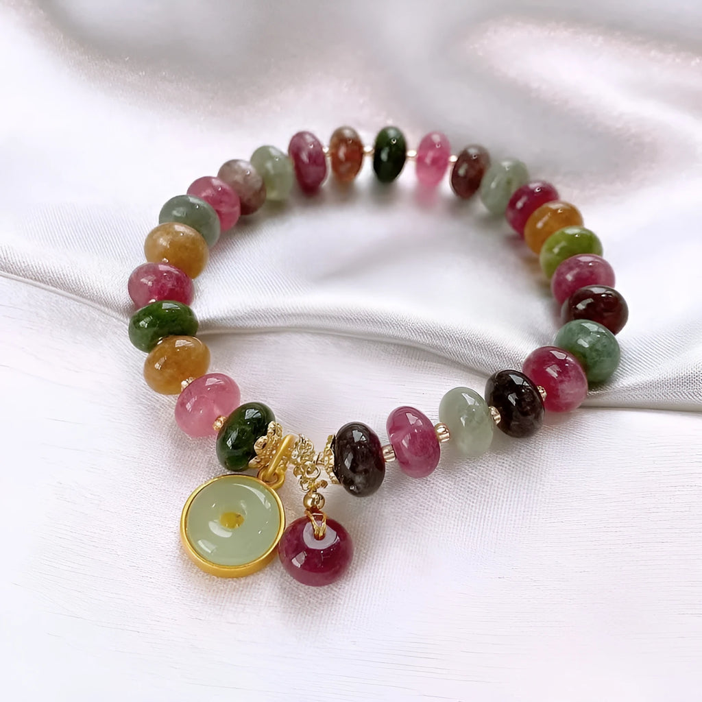 Colourful tourmaline rabbit pendant on a natural stone abacus bead bracelet.