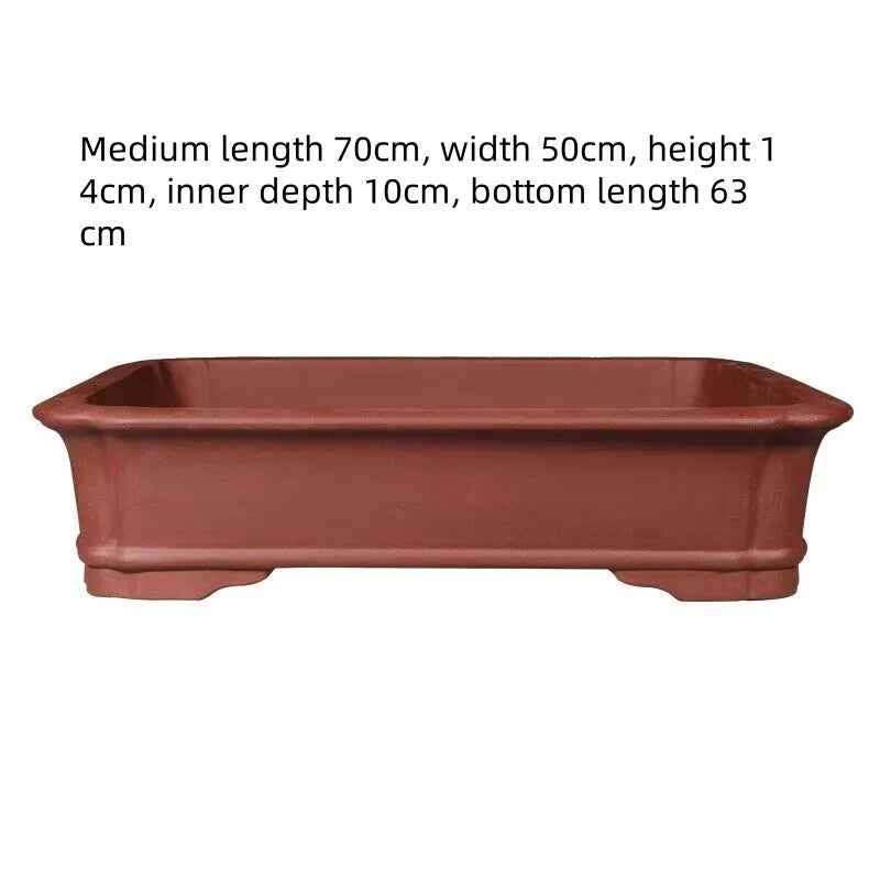 Handmade rectangular purple clay bonsai flowerpot showing its size and thickened ceramic construction.
