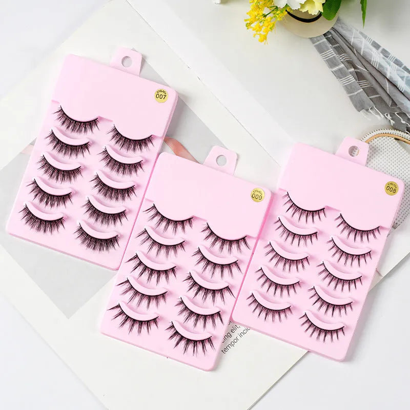 Bundle of manga false eyelashes showing three wispy styles 007, 008, and 009 on a black plastic terrier strip.