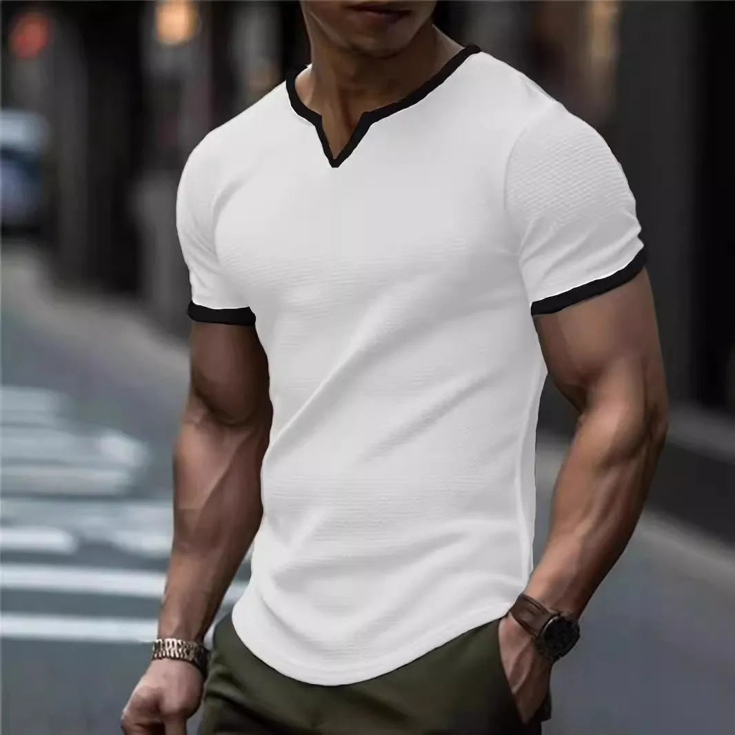 Colour-block V-neck short sleeve t-shirt in polyester waffle fabric on a neutral background.