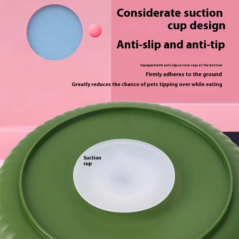 Interactive rotating slow-feed dog bowl with blue silicone licking mat in a windmill pattern.