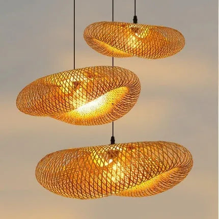Bamboo hanging lamp with straw hat-shaped rattan weave in natural tones showing light diffusion