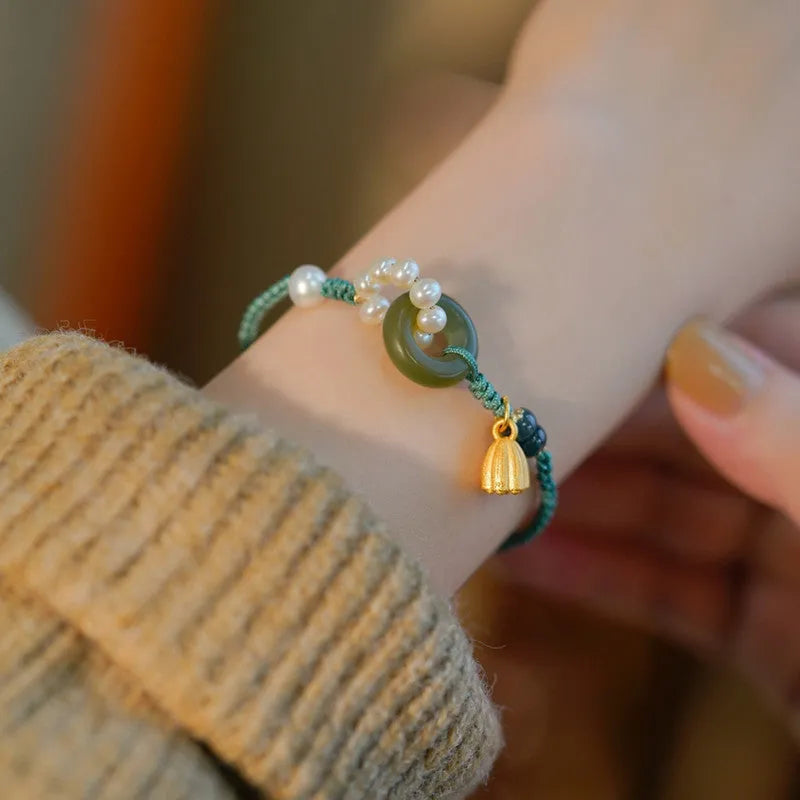 Hand-woven flexible wire watch bracelet with pearl peace buckle closure on wrist