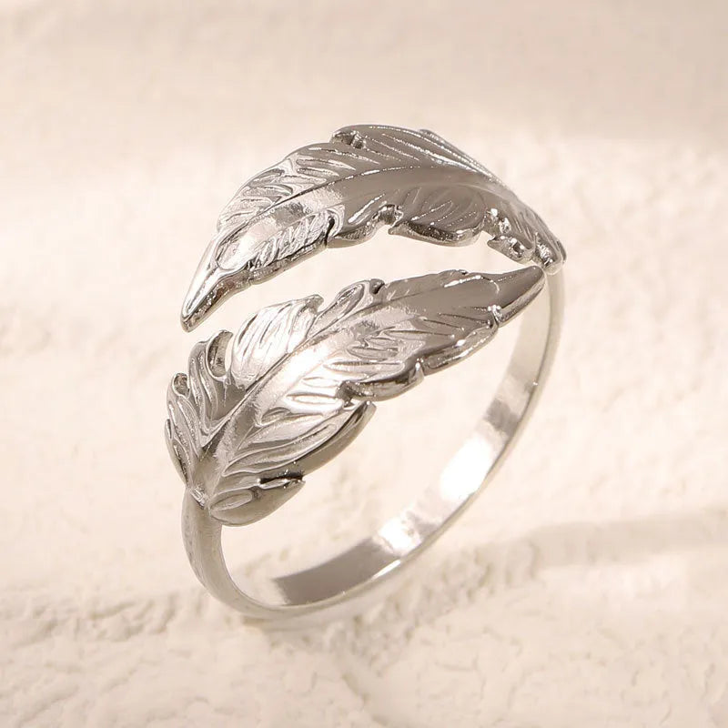 Women's adjustable feather design ring in gold and silver titanium steel options