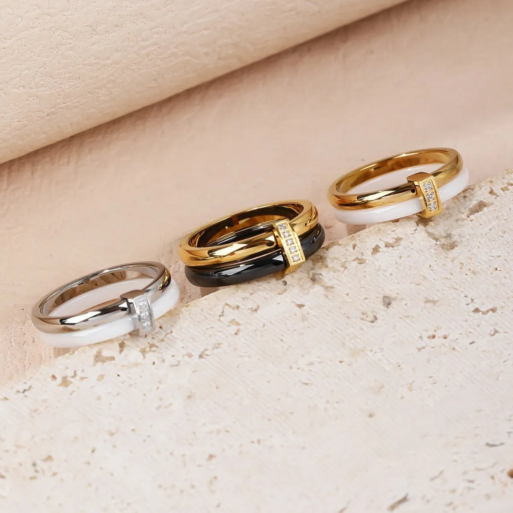 Women's titanium steel heart-shaped double ring with glossy stitching and inlaid zirconium stones.
