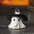 Resin wizard hat holiday ornament in purple and black colour options.