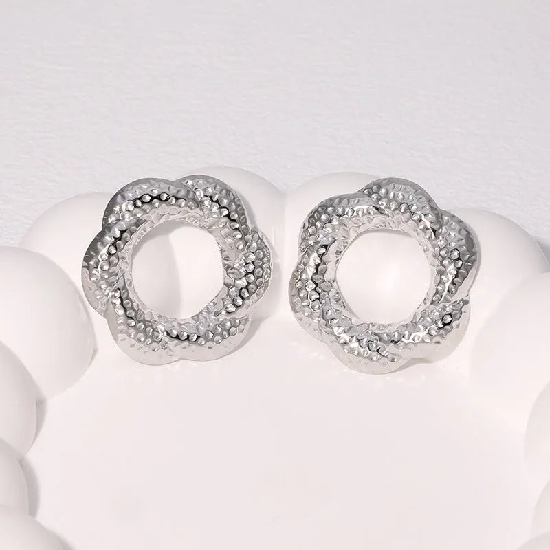 Stainless steel geometric round stud earrings in gold and steel colour, electroplated finish