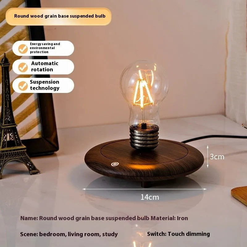 Creative iron art suspension bulb night lamp on a black wood grain desk base