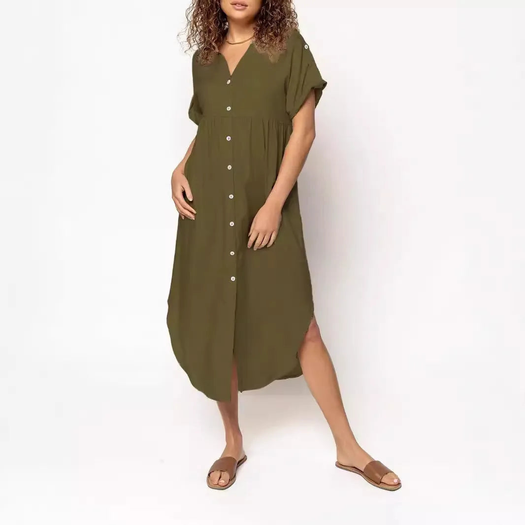 Loose-fitting mid-length casual dress with button front detail on a hanger.
