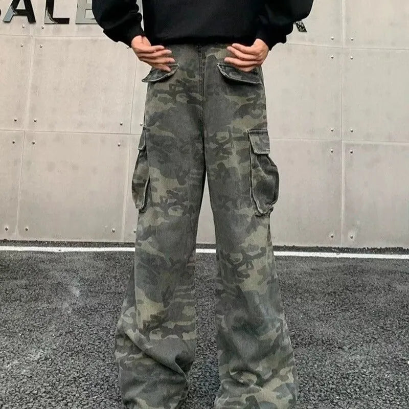 Men's olive and brown washed camouflage cargo trousers with multiple pockets on the thighs and sides.