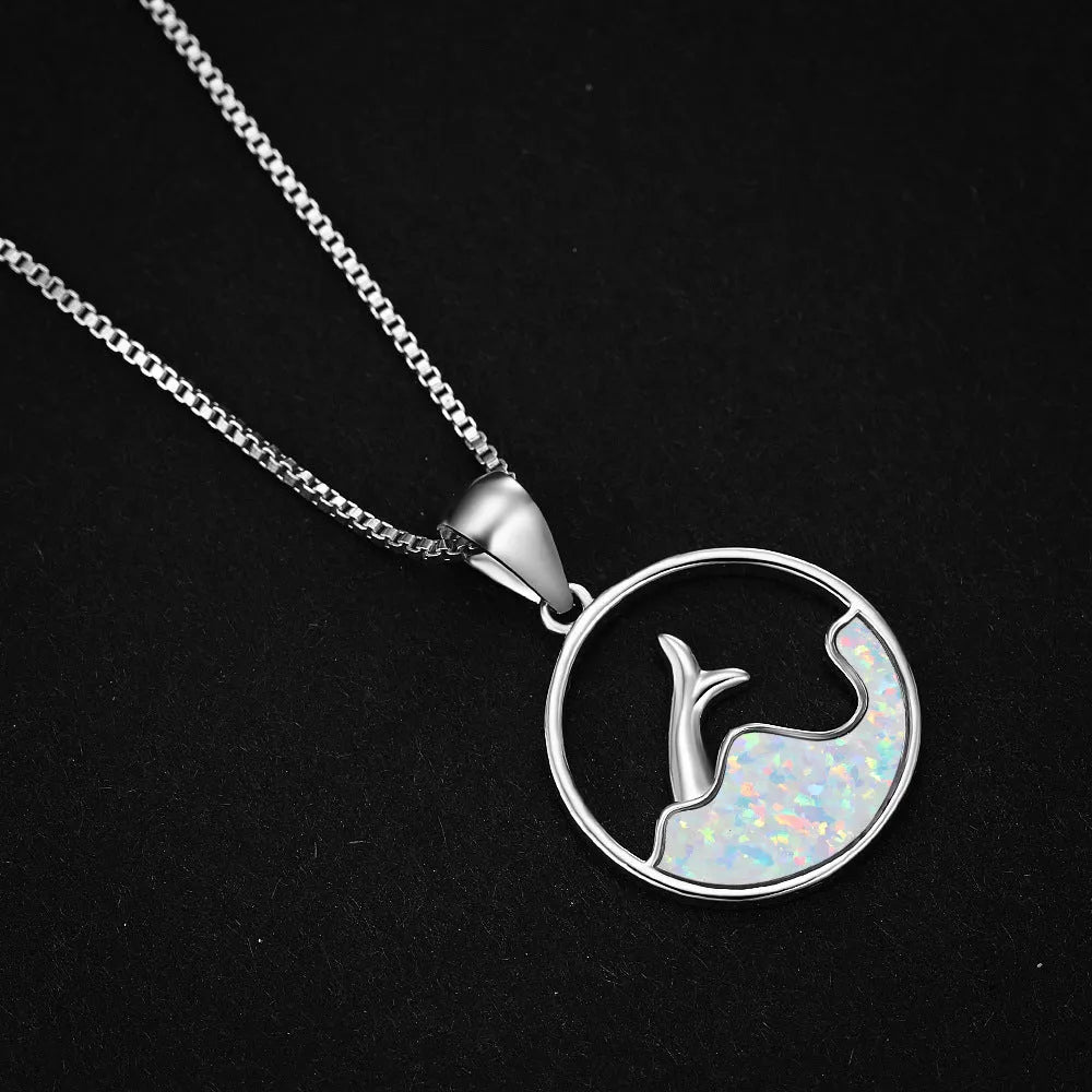 White gold electroplated copper necklace with a geometric blue opal fishtail pendant.