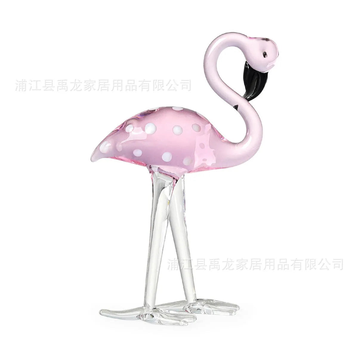 Pink flamingo crystal decorative ornament on a table in modern minimalist style.