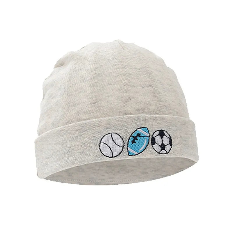 Set of white, light blue, and grey cotton baby pullover caps, gloves, and foot covers for infants.