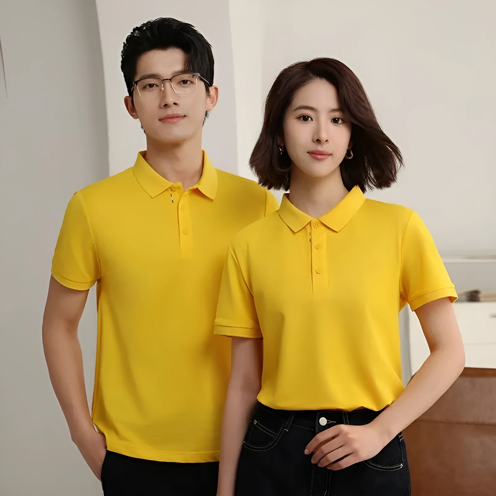 Solid colour catering work polo shirt in ice silk fabric on a hanger, showing short sleeves and regular fit.