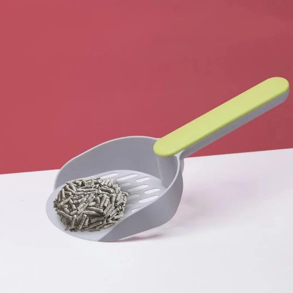 Blue plastic cat litter shovel with angled handle on a white background.