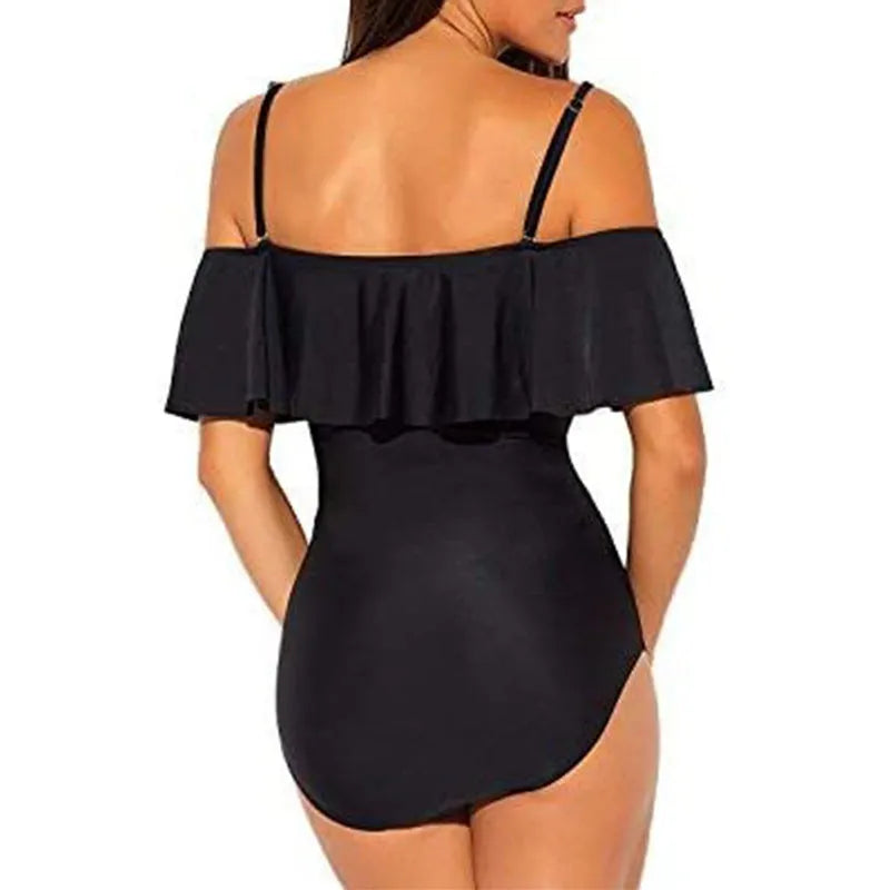 Black one-piece swimsuit with cut-out detail and ruffled strap tube top.