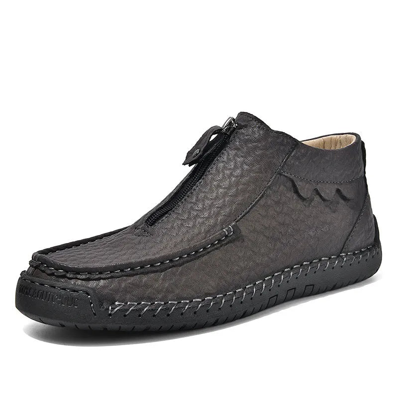 Men's black slip-on loafers with a round toe and low rubber sole.
