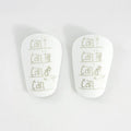 PU material football shin guards in white, black, white and black, and blue colours for training protection