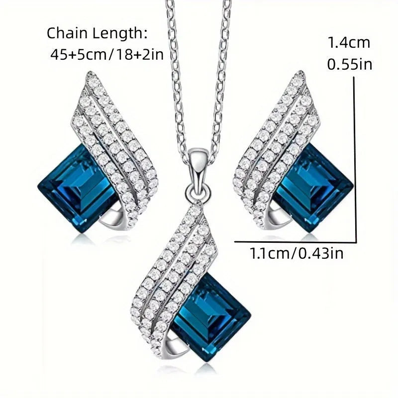 Silver-tone cross chain necklace and matching earring set with glass pendant details