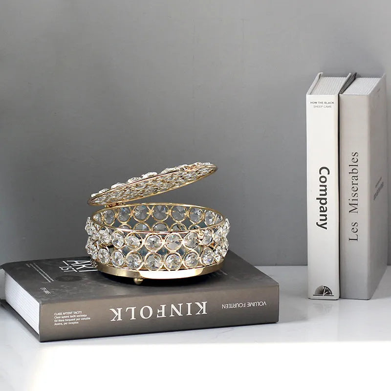 Clear crystal glass jewellery storage box with a French gold-coloured metal frame.