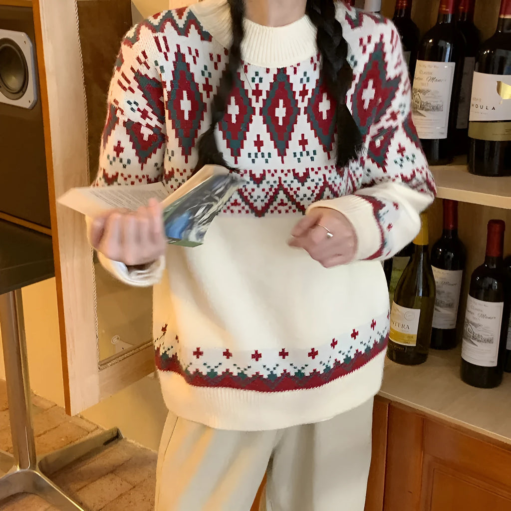 A loose-fitting striped knitted pullover top with long sleeves, shown in red and white colour options.