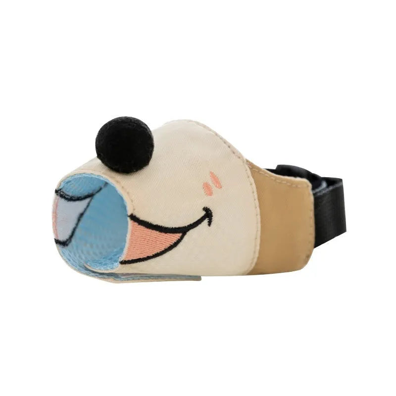 Adjustable canvas dog muzzle in Ollie Brown Bear design on a dog, showing three-strap fit.