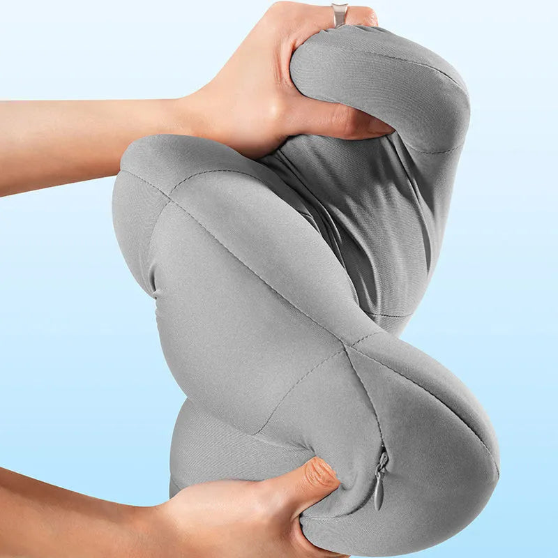 Grey and orange head restraint and lumbar support pillows for car seats.