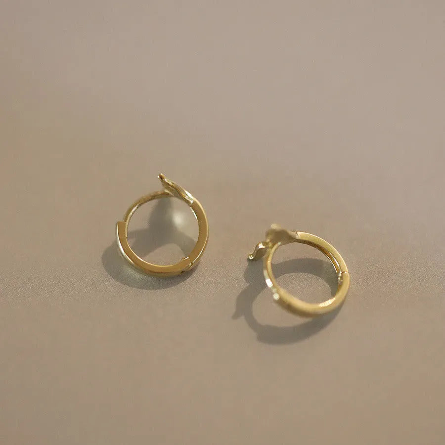 S925 sterling silver fishtail hoop earrings in gold and white gold finishes