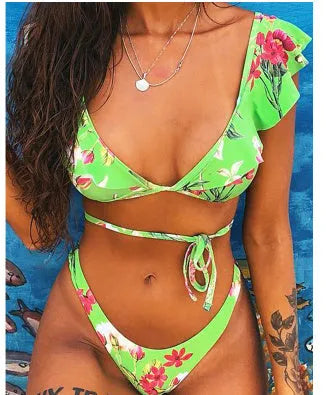 Yellow floral print split style bikini swimsuit on a mannequin.