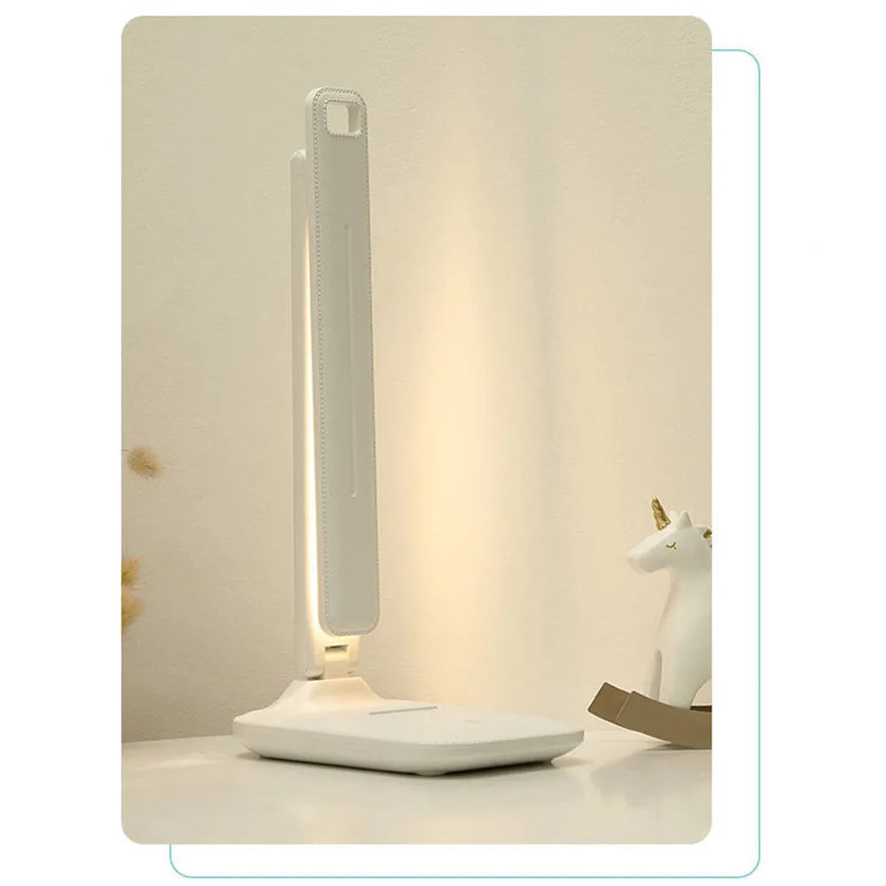 White touch dimming eye protection bedside lamp with USB charging port.