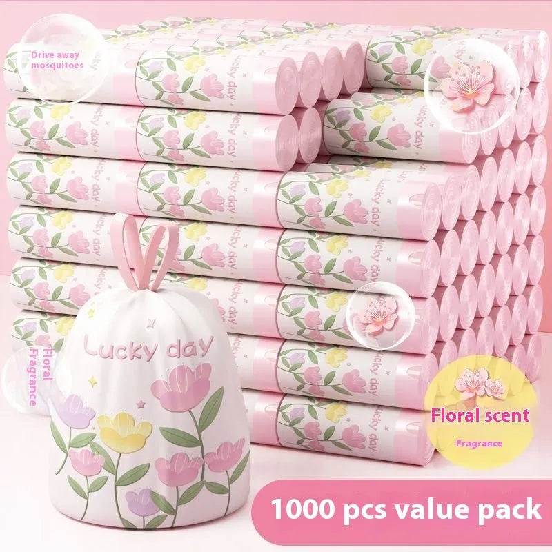 Pink degradable drawstring garbage bags with argy wormwood infusion for mosquito repellency, shown in a pack.