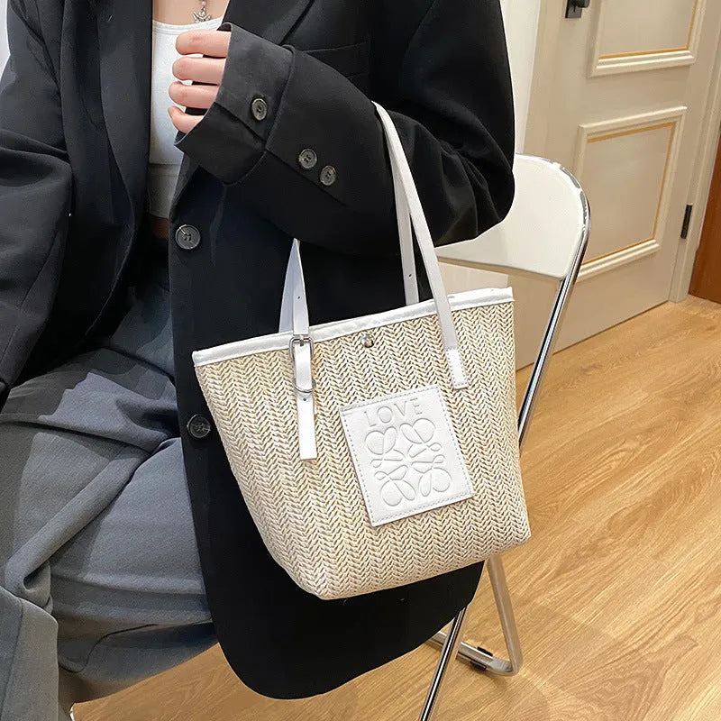 Women's woven straw shoulder bag with large capacity showing European retro styling and three-dimensional pocket