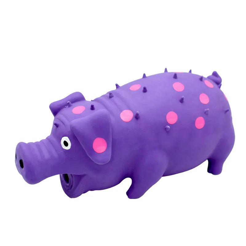 Blue latex pig-shaped dog chew toy with textured surface and squeaker on a wooden floor.