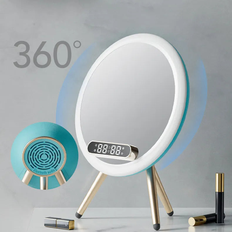White multi-function LED mirror alarm clock with wireless charger and Bluetooth speaker on a table