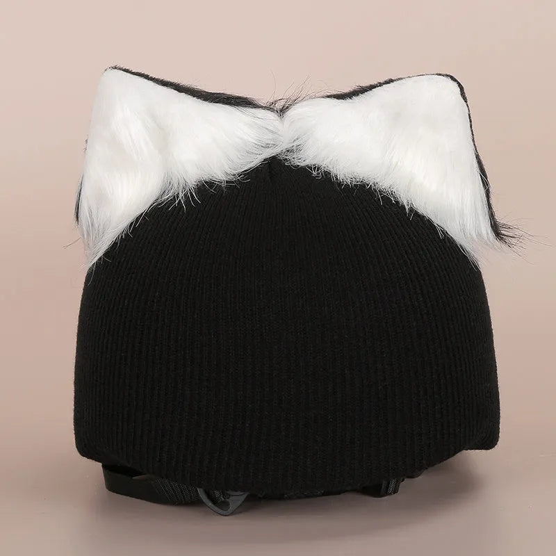 A soft plush cartoon character cover stretched over a medium-sized motorcycle helmet.