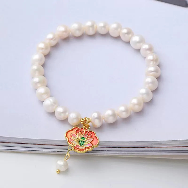 White freshwater pearl bracelet with goldfish pendant and lotus design in vintage baroque style