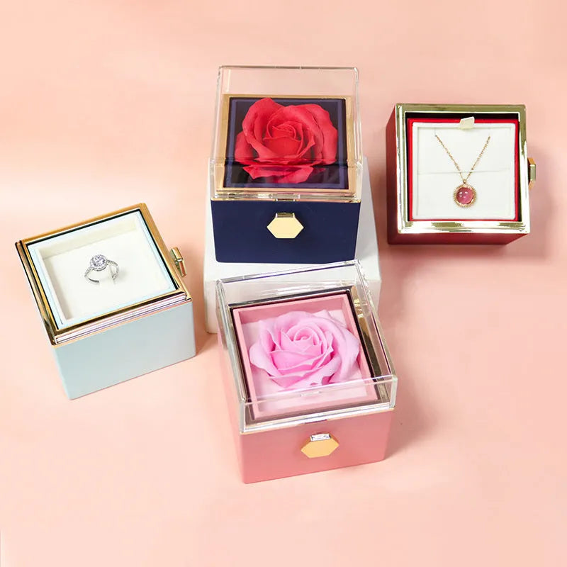Rotating drawer jewellery gift box with red preserved rose under clear acrylic dome, showing open compartment.