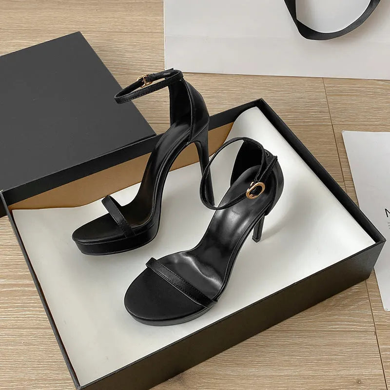 Women's black buckle high heel sandals with round toe and rubber sole