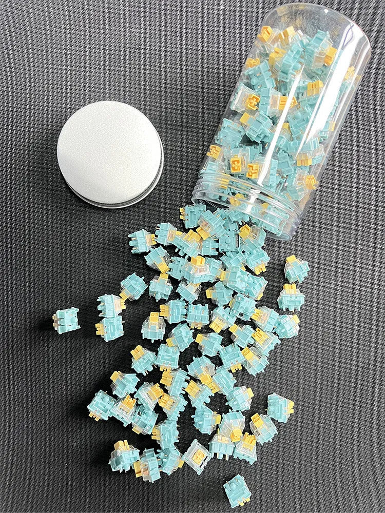 Set of 36 Sea Salt Lemon PRO Mute coloured five-pin mechanical keyboard switches.