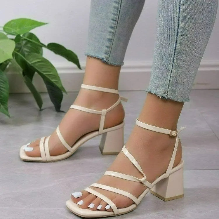 Women's plus size square toe slide sandals with an ankle buckle strap in beige.