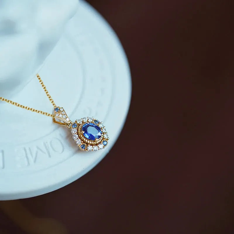 Yellow gold royal style necklace with inlaid zircon pendant on a copper box chain.