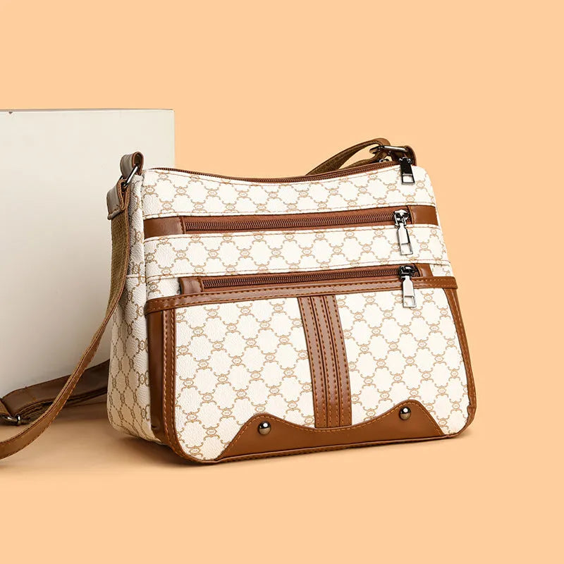 Brown women's large crossbody bag with stitching pattern on PU leather.